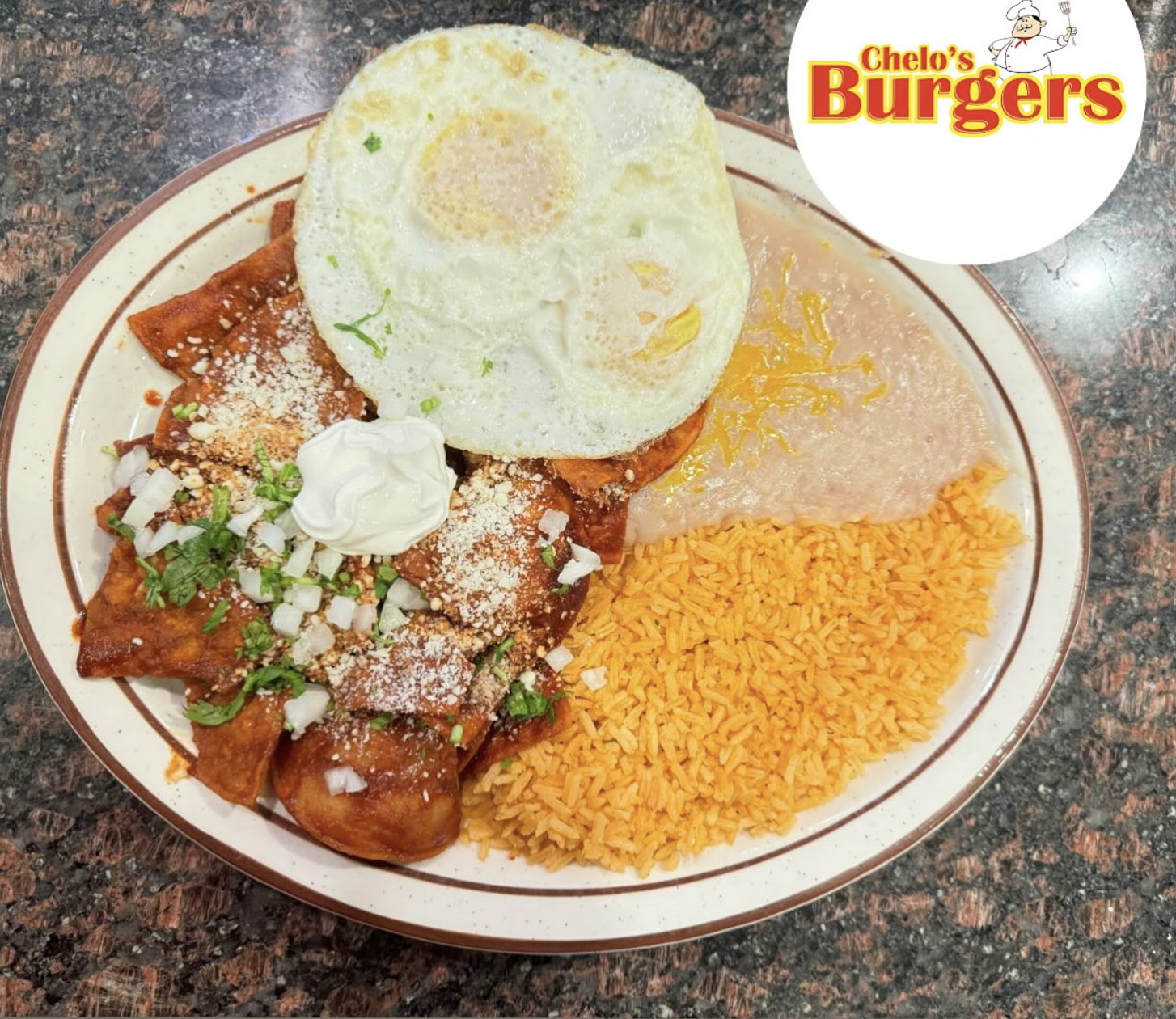 Plate of chilaquiles with eggs, rice and beans